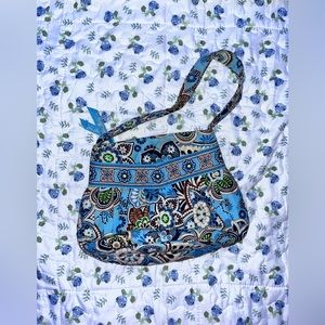Small, blue Vera Bradley purse.